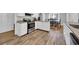 Modern kitchen featuring stainless steel appliances, granite countertops, and white cabinets at 1155 Palmetto St., Georgetown, SC 29440