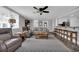 Comfortable living room with modern furniture and a gray accent rug adjacent to an open kitchen and breakfast bar at 1155 Palmetto St., Georgetown, SC 29440