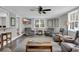 Relaxing living room featuring cozy seating, a ceiling fan, and a large window with blinds at 1155 Palmetto St., Georgetown, SC 29440