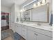 Elegant bathroom features a double sink vanity with ample storage and a framed mirror at 116 Glengrove Lane, Murrells Inlet, SC 29576