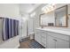 Modern bathroom with a glass-enclosed shower, dual vanities, and elegant fixtures at 116 Glengrove Lane, Murrells Inlet, SC 29576
