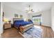 Bright bedroom boasts vaulted ceiling, ceiling fan, and a stunning view of the pond beyond at 116 Glengrove Lane, Murrells Inlet, SC 29576