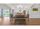 Bright dining area showcasing modern lighting, a kitchen view, and an inviting atmosphere for gatherings at 116 Glengrove Lane, Murrells Inlet, SC 29576