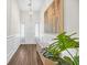 Bright foyer with hardwood floors, wainscoting, art, and a bench at 116 Glengrove Lane, Murrells Inlet, SC 29576