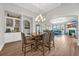 Open-concept living room with hardwood floors, tall ceilings, and plenty of natural light at 116 Glengrove Lane, Murrells Inlet, SC 29576