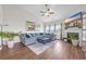 Bright living room showcasing a plush blue sectional, fireplace, vaulted ceiling, and stylish decor at 116 Glengrove Lane, Murrells Inlet, SC 29576
