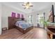 Spacious main bedroom with vaulted ceilings, hardwood floors, and an abundance of natural light at 116 Glengrove Lane, Murrells Inlet, SC 29576