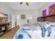 Cozy main bedroom with TV, hardwood floors, and ensuite bathroom at 116 Glengrove Lane, Murrells Inlet, SC 29576