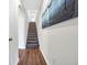 Inviting staircase with plush carpet leads to the upper level, beautifully lit at 116 Glengrove Lane, Murrells Inlet, SC 29576