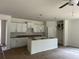 Bright kitchen with modern white cabinets, an island, and pendant lighting, ready for appliances at 118 Westfield Circle, Conway, SC 29526