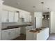 Bright kitchen with modern white cabinets, an island, and pendant lighting, ready for appliances at 118 Westfield Circle, Conway, SC 29526