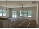 Bright living room with large windows and sliding glass doors leading to the backyard at 118 Westfield Circle, Conway, SC 29526