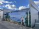 Outdoor view of a building with a pirate themed mural on the exterior brick wall at 118 Westfield Circle, Conway, SC 29526