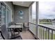 Relax on the screened-in balcony with lake views, featuring seating and coastal decor at 121 Waypoint Ridge Ave. # P-15, Little River, SC 29566