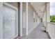 Inviting exterior hallway with 'WELCOME' sign, showcasing access to condo entrances at 121 Waypoint Ridge Ave. # P-15, Little River, SC 29566