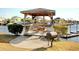 Exterior view of a gazebo with a picnic table and a grill at 121 Waypoint Ridge Ave. # P-15, Little River, SC 29566