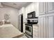 Bright kitchen featuring stainless steel appliances and white cabinets at 121 Waypoint Ridge Ave. # P-15, Little River, SC 29566