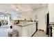 Open-concept kitchen with modern appliances and a view of the dining area at 121 Waypoint Ridge Ave. # P-15, Little River, SC 29566