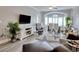 Comfortable living area includes entertainment center, dining area, and coastal decor at 121 Waypoint Ridge Ave. # P-15, Little River, SC 29566