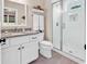 Stylish bathroom with white vanity, granite countertop, and glass-enclosed shower at 1210 East Isle Of Palms Ave., Myrtle Beach, SC 29579