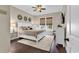 Comfortable bedroom with a white bed frame, ceiling fan, and natural light, showcasing a peaceful retreat at 1210 East Isle Of Palms Ave., Myrtle Beach, SC 29579