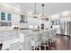 Bright, airy kitchen with white cabinetry, stainless steel appliances, and a spacious center island with seating at 1210 East Isle Of Palms Ave., Myrtle Beach, SC 29579