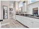 Luxurious main bathroom with double vanity, white cabinets, and a separate water closet at 1210 East Isle Of Palms Ave., Myrtle Beach, SC 29579