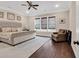 Serene main bedroom with a tufted headboard, decorative artwork, and ample natural light at 1210 East Isle Of Palms Ave., Myrtle Beach, SC 29579
