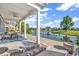 Outdoor patio with beautiful pond views, a ceiling fan, and a dining table at 1210 East Isle Of Palms Ave., Myrtle Beach, SC 29579