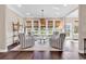 Cozy sitting room with neutral decor, comfortable seating, and large windows overlooking the yard at 1210 East Isle Of Palms Ave., Myrtle Beach, SC 29579