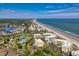 Aerial view of a beachfront community with ocean views at 135 S Dunes Dr. # 501, Pawleys Island, SC 29585