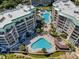 Aerial view of a resort complex with multiple pools and buildings surrounded by lush landscaping and trees at 135 S Dunes Dr. # 501, Pawleys Island, SC 29585