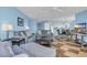 Inviting living room with comfortable seating and an open flow to the kitchen and dining area at 135 S Dunes Dr. # 501, Pawleys Island, SC 29585