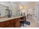 Primary bathroom with double sinks, granite countertops, walk-in shower, and a walk-in closet at 15 Saltwind Loop, Murrells Inlet, SC 29576