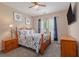 Cozy bedroom features wood furniture, carpet flooring, ceiling fan and natural light from the windows at 15 Saltwind Loop, Murrells Inlet, SC 29576