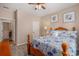 Comfortable bedroom features coastal decor, a ceiling fan and a view into the Primary bathroom at 15 Saltwind Loop, Murrells Inlet, SC 29576