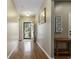 Inviting foyer with polished hardwood floors, neutral paint, and a clear view to the outdoors through a beautifully decorated door at 15 Saltwind Loop, Murrells Inlet, SC 29576