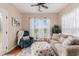 Cozy living room with a ceiling fan, area rug, sofa, chair, ottoman and lots of natural light at 15 Saltwind Loop, Murrells Inlet, SC 29576