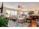 Spacious living room boasts an open layout, hardwood floors, and a large sectional sofa, perfect for relaxation and entertainment at 15 Saltwind Loop, Murrells Inlet, SC 29576
