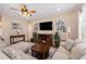 Cozy living room with a warm fireplace, a large flat-screen TV, comfortable seating, and stylish decor, creating a relaxing space at 15 Saltwind Loop, Murrells Inlet, SC 29576