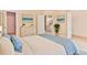 Comfortable bedroom featuring a soft color palette, a walk-in closet, an ensuite bath, and a decorative dresser at 155 Mckenzie Circle, Pawleys Island, SC 29585