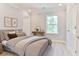 Serene bedroom with an ensuite bath and hardwood floors at 155 Mckenzie Circle, Pawleys Island, SC 29585