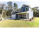A beautiful blue two-story home with a front porch to relax on a sunny afternoon at 155 Mckenzie Circle, Pawleys Island, SC 29585