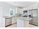 Modern kitchen with granite countertops, stainless steel appliances, and plenty of natural light at 155 Mckenzie Circle, Pawleys Island, SC 29585