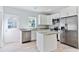Well-lit kitchen featuring stainless steel appliances, granite countertops, and a kitchen island at 155 Mckenzie Circle, Pawleys Island, SC 29585