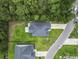 Overhead shot of a house with a wide green lawn and trees behind at 1600 Palmetto Palm Dr., Myrtle Beach, SC 29579