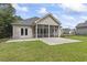 Relaxing screened-in back porch with ceiling fan and concrete patio at 1600 Palmetto Palm Dr., Myrtle Beach, SC 29579