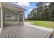 A spacious backyard view from the screened-in porch and a concrete patio at 1600 Palmetto Palm Dr., Myrtle Beach, SC 29579