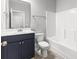Bathroom with a blue vanity, white countertop, and tub at 1600 Palmetto Palm Dr., Myrtle Beach, SC 29579