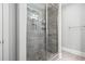 Shower with tiled walls, a glass door, and a shower head at 1600 Palmetto Palm Dr., Myrtle Beach, SC 29579